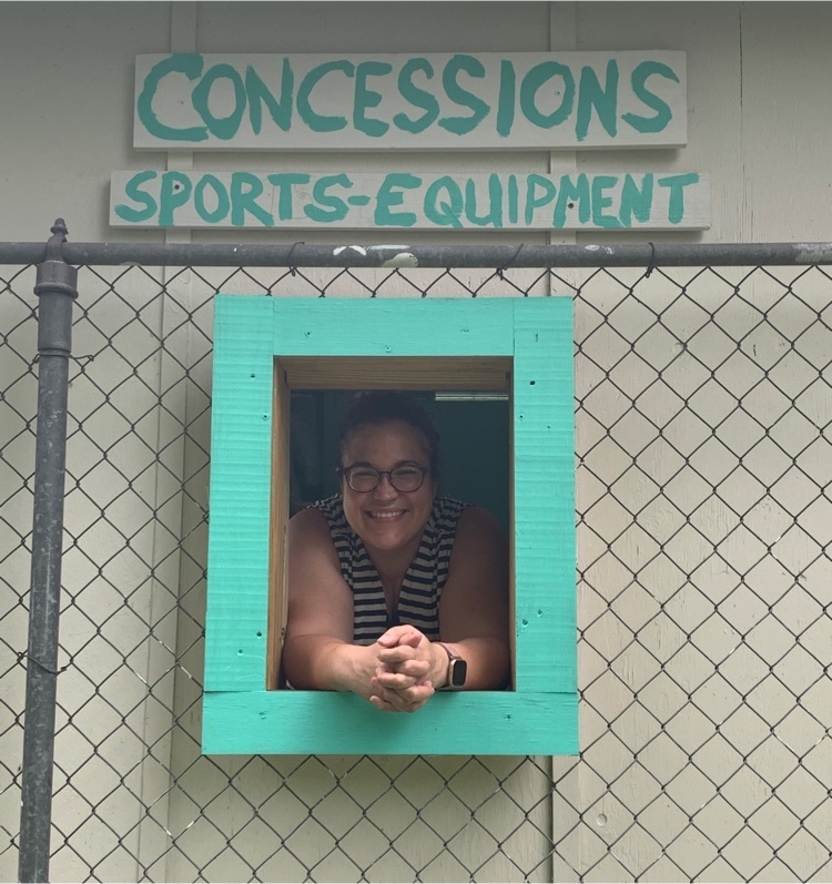 sports equipment check out and woman smiling in window